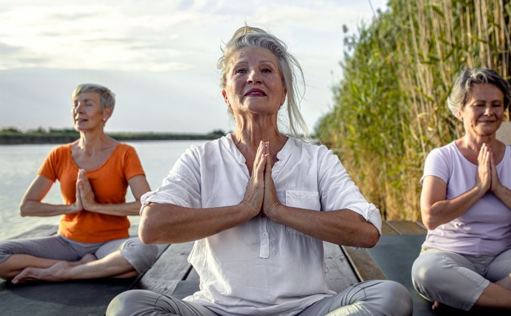 group-of-senior-woman-doing-yoga-exercises-by-the-2023-11-27-05-37-17-utc-1